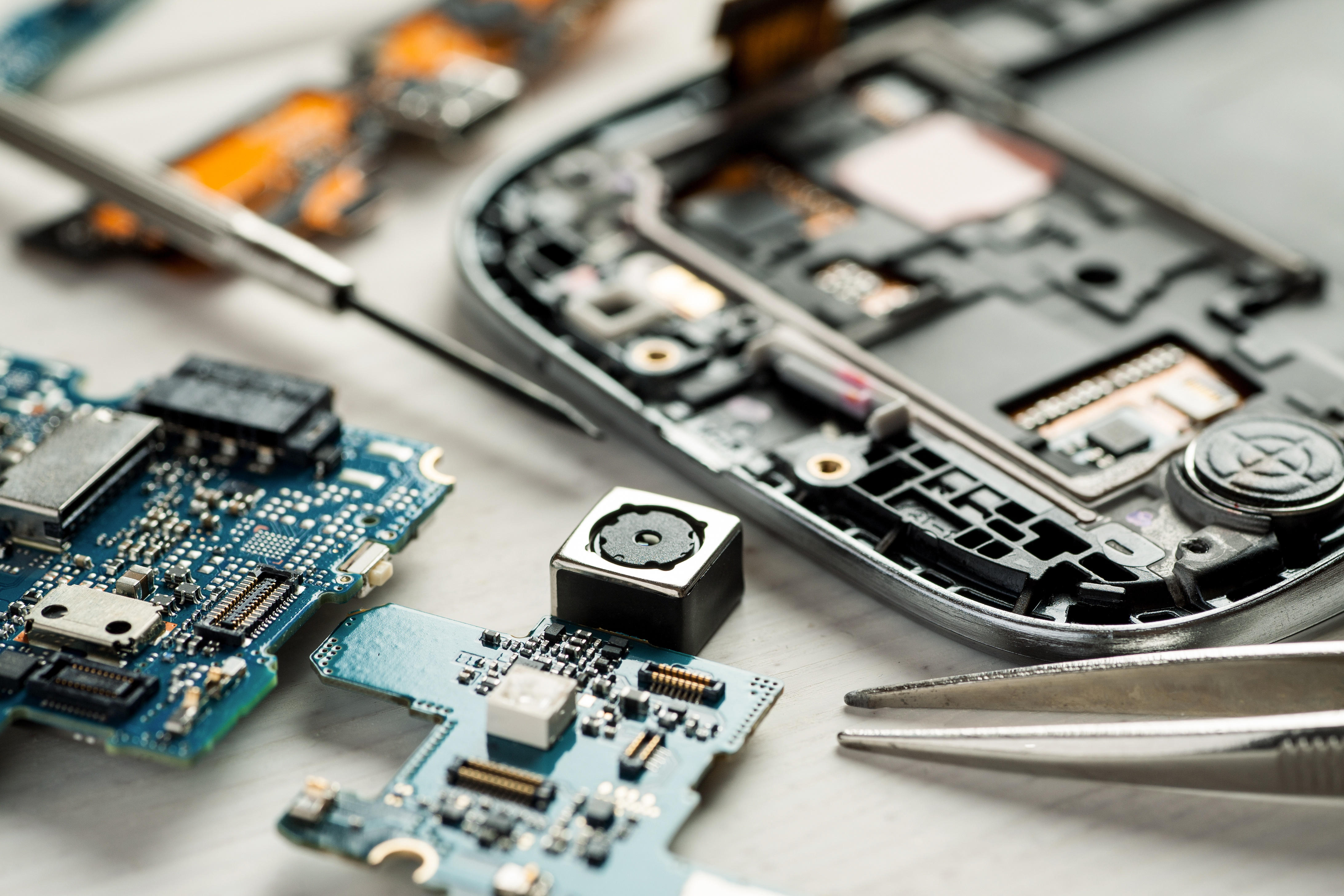 Parts of digital gadgets with tools. Repair and service concept.